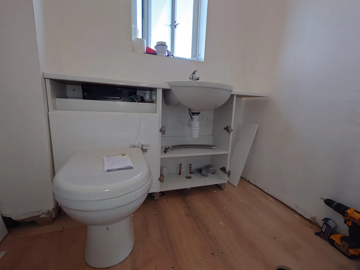 Back-to-wall toilet and vanity unit being fitted in Starcross
