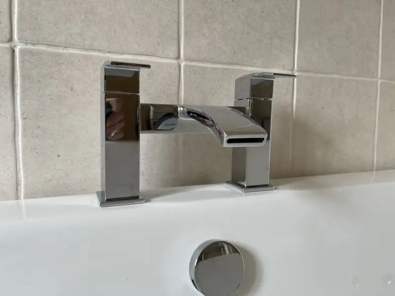 New chrome bath mixer tap fitted on a tiled bath in Exeter