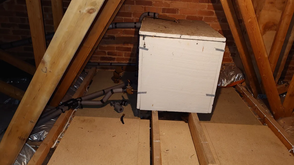 Cold water storage tank in a loft in Exeter