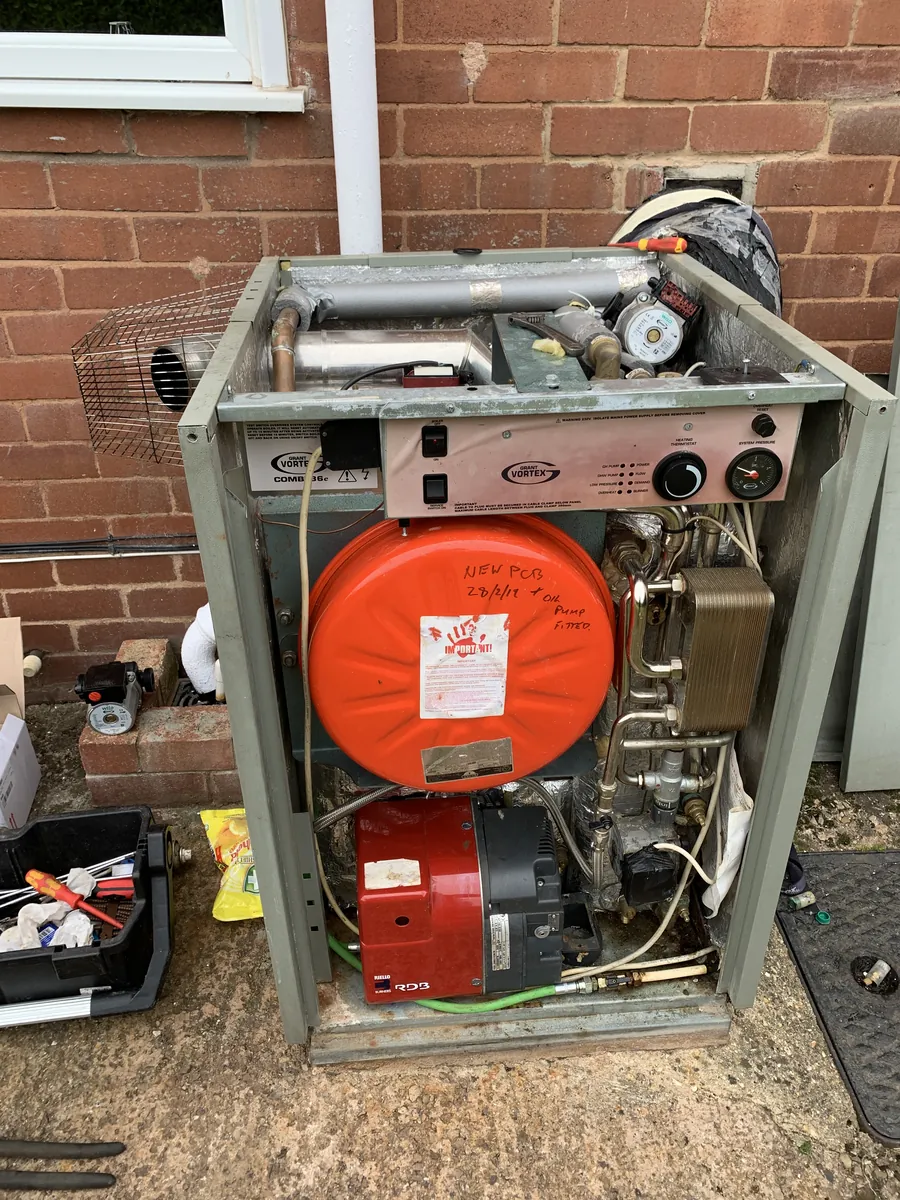Grant Vortex external oil boiler open for repair in Exeter