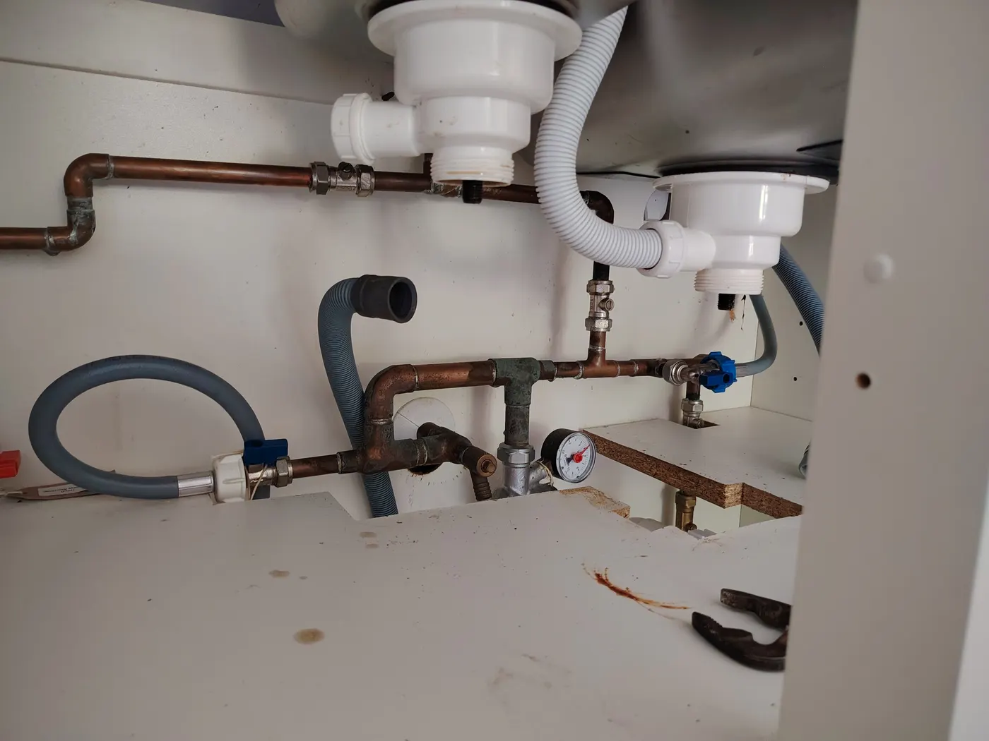 Leaking kitchen sink waste pipe found in the cupboard during a repair in Exminster
