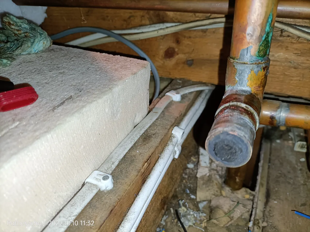 Central heating pipe cut open in an Exeter house showing it almost blocked with sludge