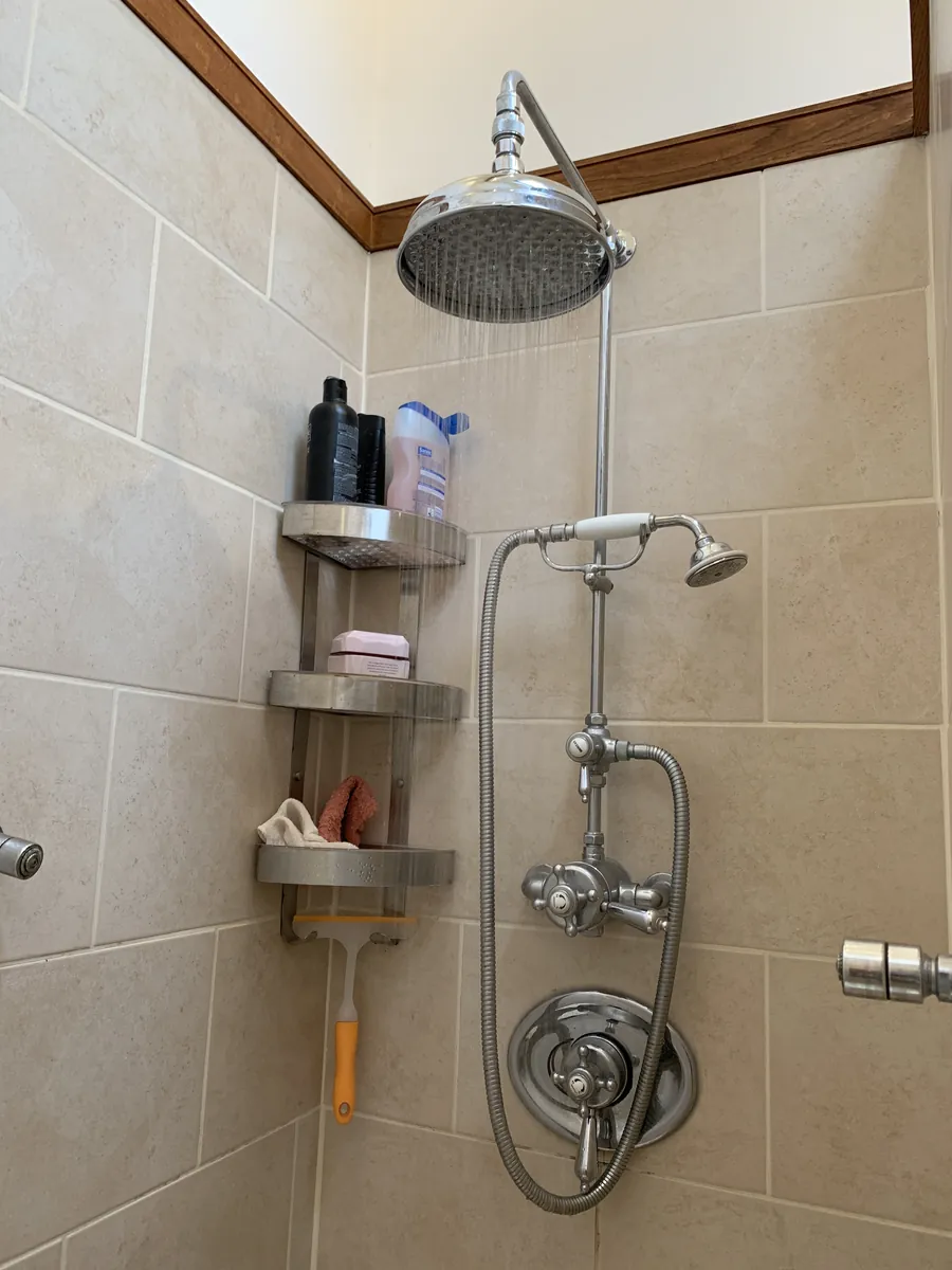 Rain head shower with riser and handset installed in Exeter