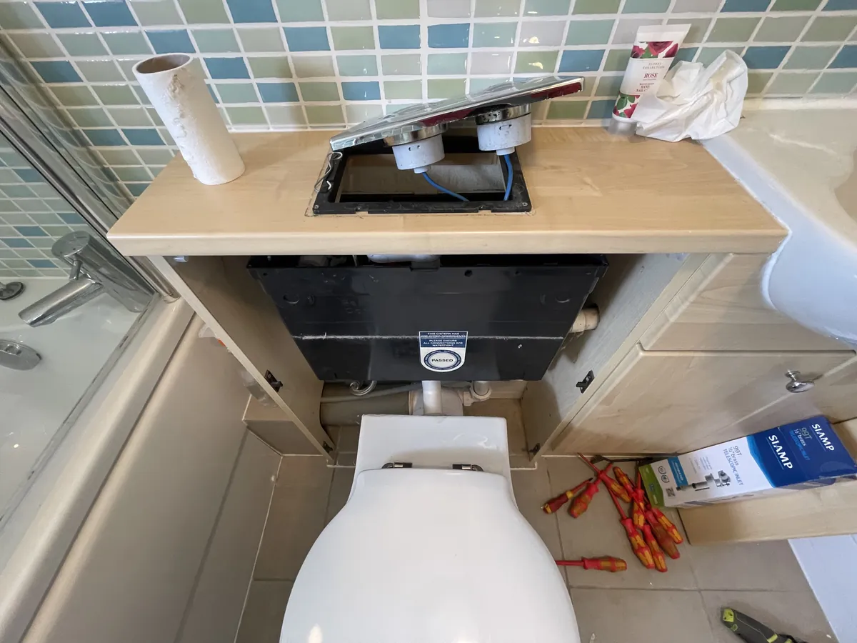 Concealed cistern frame for a wall-hung toilet during a bathroom installation in Exeter